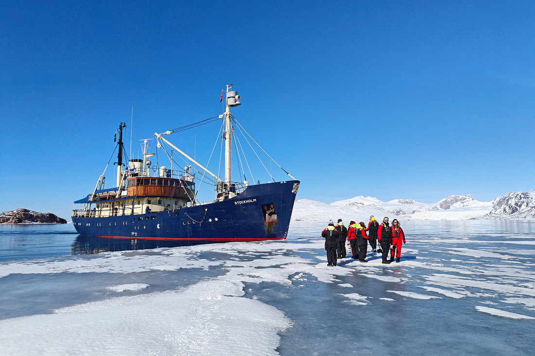 Wildlife Worldwide group on the ice in front of M/S Stockholm, Kongsfjorden, Svalbard by Bret Charman